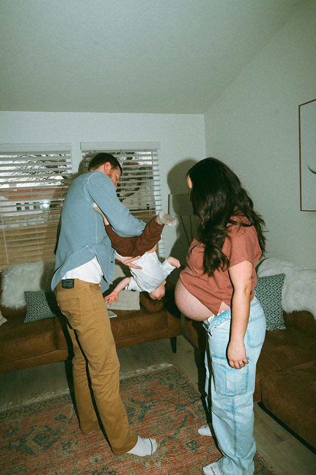 dad giving a toddler a little helicopter ride, one of the best faceless photo ideas