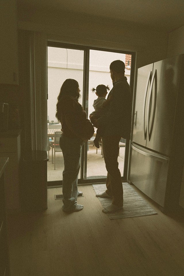 a family from the back looking out the window, one of the best faceless photo ideas