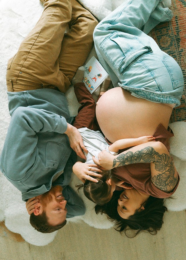 a family hugging in bed, one of the best faceless photo ideas