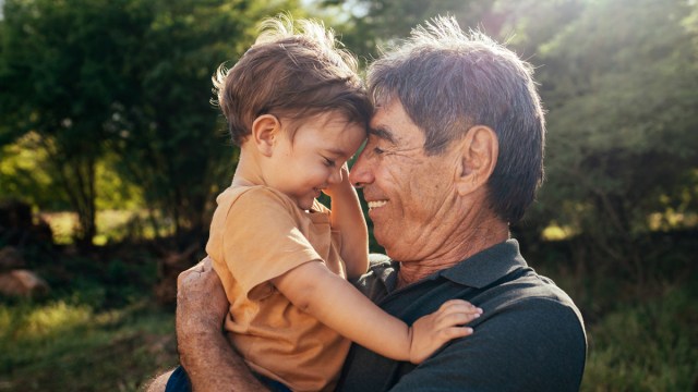 grandad snuggling with his grandson while not breaking a grandparents rule