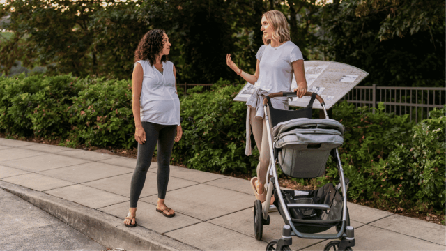 mom friends hanging out, one pregnant and the other with a stroller