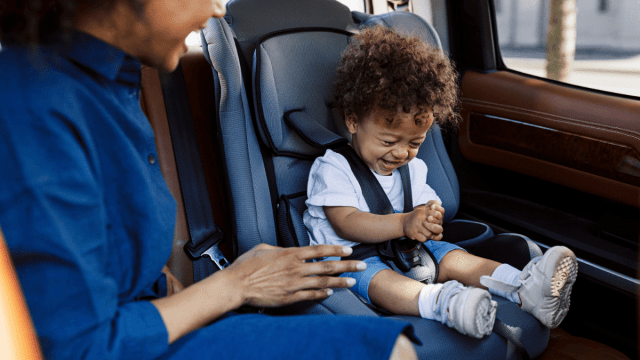 mom checking her road trip with baby checklist